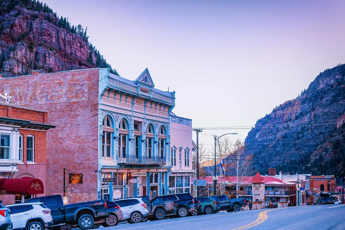 Ouray at sunset on October 28, 2022, in its narrow valley ringed by mountains.