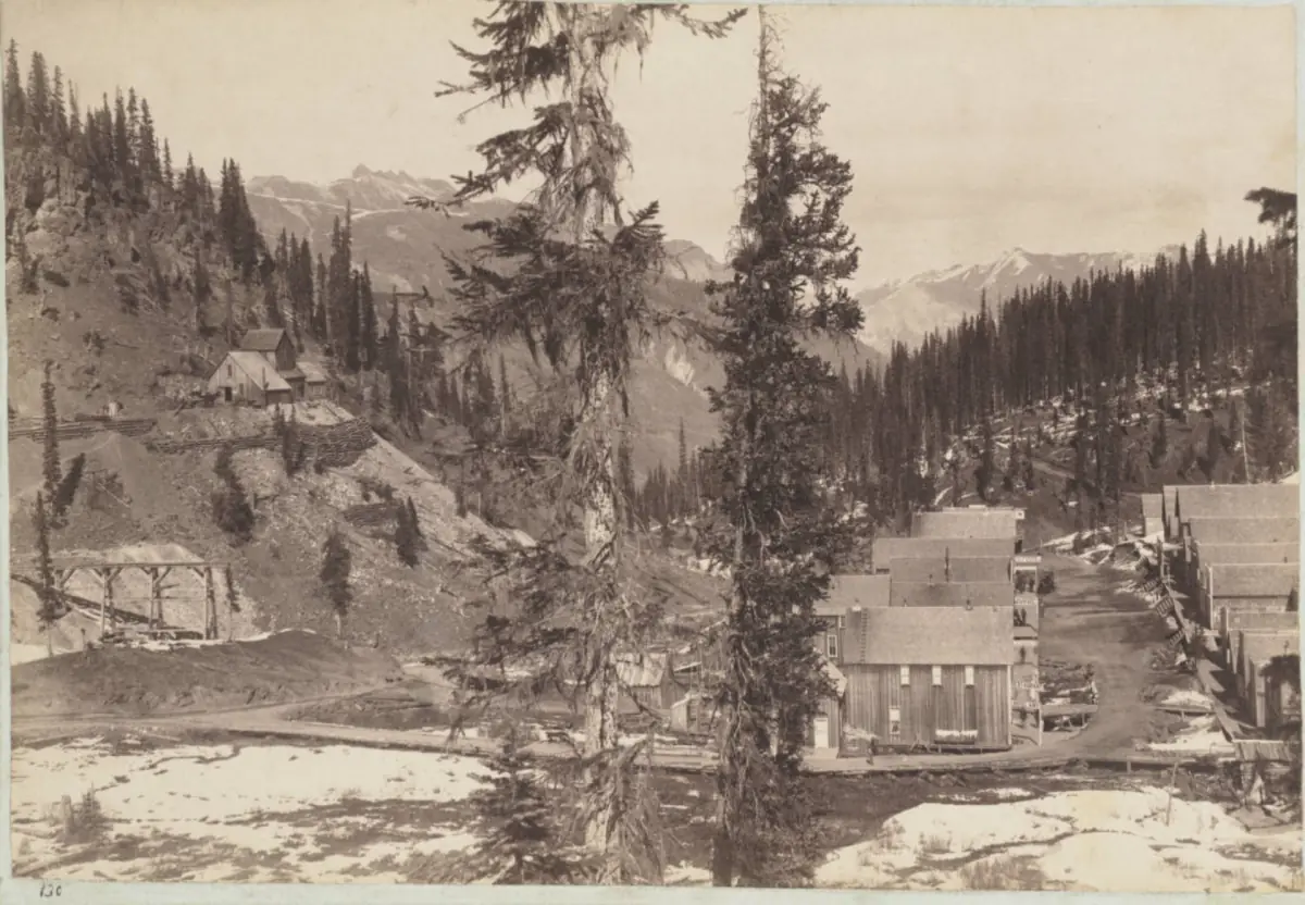 Main street and business district of Red Mountain Town around 1890, photographed by W. J. Carpenter, with mine workings on the hillside at left.
